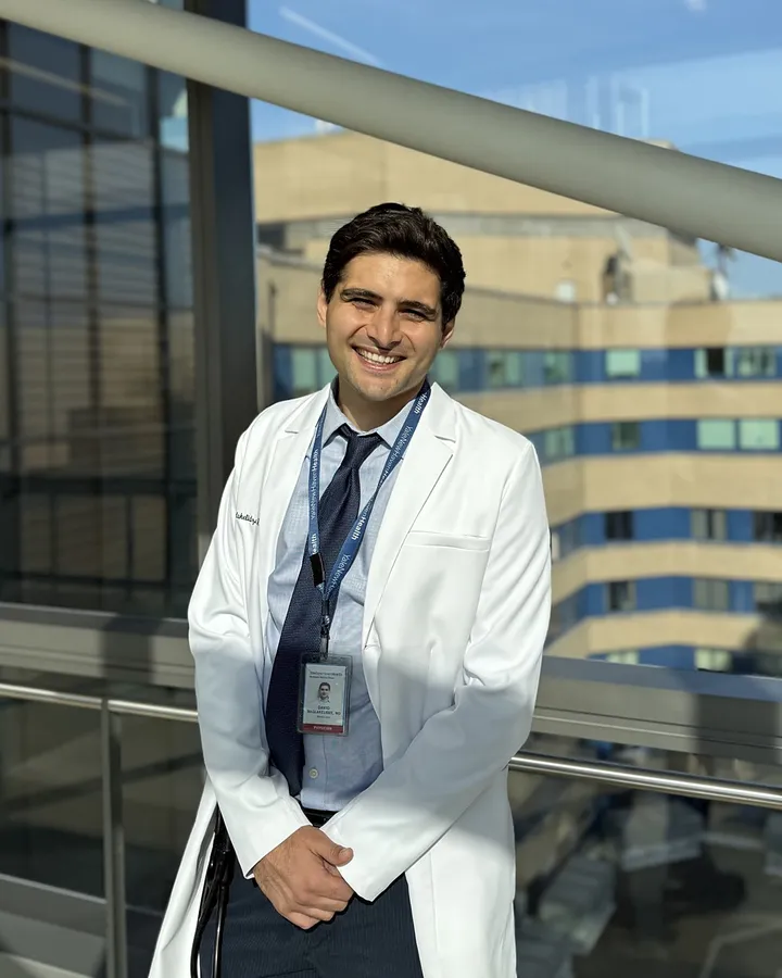 David Maglakelidze, MD, in a white coat at Yale New Haven Hospital